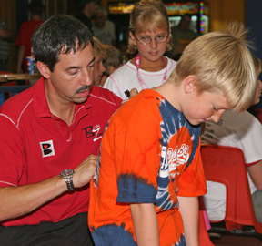 Parker Bohn III signs an augtoraph for a fan