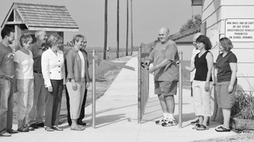 cutting ribbon on trail