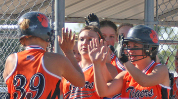 Annie Dostal celebrats home run with teammates